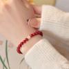 Sob a figueira-de-bengala, o vento nacional vermelho cinábrio natural pulseira de contas de jade Hetian feminina este ano pulseira de contas de transferência presente atacado