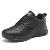 Tênis esportivos de couro impermeáveis para mulheres, perfeitos para a primavera, confortáveis para longos períodos em pé, com sola macia, design todo preto, adequados para o trabalho e antiderrapantes, ideais como sapatos de cozinha para mães