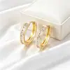 Pendientes redondos geométricos transfronterizos Xuping europeos y americanos, aleación de cobre de moda incrustada con gemas artificiales, pendientes circulares para mujer al por mayor