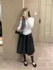 Falda Midi de Lunares Atmosférica Elegante Cintura Alta Lazo en la Cintura Silueta Forma de Botón Falda Otoño Nuevo 2026 Negro