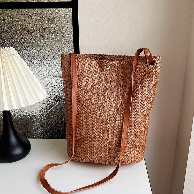 编织包女包新款潮2024夏草编简约百搭小清新水桶包个性单肩斜