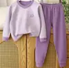 Novas roupas de outono e inverno para meninos e meninas, conjunto de calças compridas, crianças médias e grandes, bebê, caxemira, seda, sem costura, roupa térmica infantil