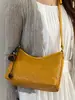 Bolso pequeño cuadrado de color liso con patrón tejido simple de estilo alto Shuai Mi Jia, bolso de hombro cruzado para el día a día informal y relajado