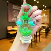Llavero acrílico con forma de botella de arenas movedizas en aceite, regalo al por mayor, colgante de muñeca de donut, lindo llavero de arenas movedizas.
