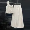 Llegada Nueva Verano 2026 Conjunto de Moda con Flores 3D para Mujer Top Corto de Un Hombro Nicho + Pantalones Casuales de Pierna Ancha