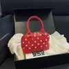 Bolsa de concha com poá estilo coreano transfronteiriça, bolsas de poá de nicho, de mão e transversal, luxo leve, bolsa de ombro moderna e estilosa