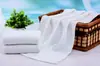 Fábrica de Gaoyang toalla blanca desechable para hotel salón de belleza toalla de baño de algodón venta al por mayor toalla de hotel regalo de agradecimiento
