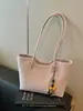 Bolso de mujer de color liso retro de nicho 2026 nueva versión coreana bolso tote simple casual de gran capacidad para el hombro de uso diario