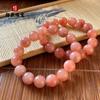 Pulsera de jade dorado natural al por mayor de fabricantes de pulseras de melocotón de bienestar de drenaje en vivo color rosa melocotón vino de flor de melocotón cuentas redondas