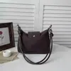Nova bolsa de ombro e transversal retrô Maillard de camurça transfronteiriça para mulheres, bolsa de nicho para o dia a dia com alça de corda torcida