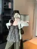 Nuevo conjunto coreano suelto de dos piezas para principios de otoño: top de tirantes con estampado de leopardo y cárdigan de punto