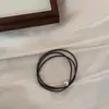 Diadema Exquisita de Perlas Estilo Hepburn Francés 2025 Nueva Banda de Goma de Gama Alta para el Cabello de Mujer Estuche de Cuero Elegante