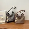 Bolso bandolera de gran capacidad para mujer, nuevo modelo de verano 2026, moda casual de nicho, bolso de hombro ligero para ir al trabajo, bolso tipo cubo