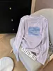 Estilo nuevo 2026, corte regular, algodón con diseño de copo de nieve, cuello redondo, manga larga, camiseta para mujer, moderna y versátil, capa interior blanca, estilo fino de otoño