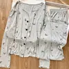 Pijama de estampado completo para mujer para primavera, verano y otoño, con mangas largas, cárdigan de punto acanalado de seda helada, ropa de estar holgada y un conjunto de dibujos animados moderno