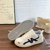 Zapatillas de entrenamiento alemanas de suela gruesa para mujer, nuevo modelo de verano 2026, estilo Hong Kong, zapatillas casuales blancas versátiles de nicho, zapatillas deportivas transpirables