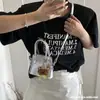 Bolsa Infantil Otoño 2026 Nueva Coreana Nicho Versátil Estilo de Alta Gama Monedero de Hombro Cruzado Bolso de Concha Simple