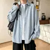 Camisa de manga larga a rayas para hombre, nuevo estilo otoño 2026, camisa tipo chaqueta de corte holgado, talla grande, top versátil
