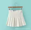 Falda corta estilo coreano falda plisada línea A falda corta de cintura alta para mujer falda plisada de color liso estilo universitario especificaciones al por mayor