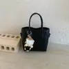 Bolso Cubo Casual de Nicho Retro de Moda 2026 Otoño Nuevo Color Sólido Ligero para Viajes Cruzado al Hombro