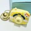Brinquedo Infantil Luminoso de Desenho Animado Mini Câmera de Projeção Chaveiro Pingente para Mochila Feminina Boneca de Câmera Pequena Criativa