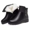 Botas de algodón para mujer 2026 invierno nuevo estilo zapatos de cuero para mediana edad y ancianos suela plana antideslizante botines cortos engrosados terciopelo cálido zapatos de algodón para madre mujer