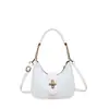 La popular bolsa de hombro dulce tipo bollo de este año para mujer, nuevo estilo Otoño 2026, textura de color liso, bolso de un solo hombro, para ir al trabajo, bolso cruzado