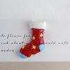 Serie navideña Calcetines de Papá Noel accesorios de resina de muñeco de nieve materiales de decoración navideña para funda de teléfono DIY accesorios para el cabello