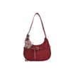 Elegante bolso de axila estilo francés para mujer, nuevo modelo 2025, bolso de media luna de diseño nicho, bolso versátil de un solo color para hombro y cruzado