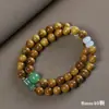 Sándalo Dorado DIY Estilo Nacional Diseño de Nicho Pulsera de Doble Círculo para Mujer Colgante de Loto de Jade Pulsera de Cuentas de Madera de Buda