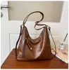 Bolsa Tote Retro de Grande Capacidade para o Dia a Dia Feminina 2026 Nova Casual de Ombro Único Transversal Mochila Multifuncional de Moda