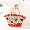 Llavero de bolsa pequeña con pedrería transfronteriza, colgante de bolso de mano de moda con incrustaciones de diamantes, accesorio de regalo para decoración de bolso de mujer