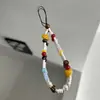 Original hecho en casa pulsera corta de cuentas de cerámica linda color de contraste cadena para colgar el teléfono móvil correa para cámara regalo para amigas
