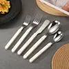 Serie innovadora de cubiertos western de acero inoxidable con mango de remache 430: cuchillo para bistec, tenedor, cuchara, cuchillo para mantequilla, serie de postre