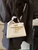Bolsa Nueva Estilo 2025 Senmeng Texturizada Patrón Lichi Hombro Cuadrada Pequeña Bolsa de Mujer Verano Portátil Bolso Kelly Bolso Mensajero