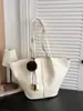 Bolsa tote grande de outono/inverno transfronteiriça nova para mulheres, bolsa de ombro simples e fashion 2026, adequada para trabalho e deslocamento, e pode ser carregada sob o braço