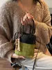 Bolso Retro de Ante Transfronterizo para Mujer 2026 Nuevo Bolso Cruzado de Nicho Moda de Alta Gama Patchwork Bolso Cubo de Moda