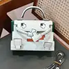 Bestseller de Primavera 2026: Bolso de Muñeca Mosaico, Bolso Kelly, Bolso de Mano de Diseño Nicho, Bolso de Hombro y Cruzado con Patrón de Dibujos Animados
