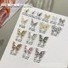 Nuevos Adornos para Uñas de Mariposa Líquida de Aleación Celebridad de Internet Estilo Retro Lujo Ligero Alas Simétricas Adornos para Uñas Venta al por Mayor