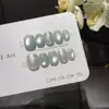 Azul Hielo ConchaEstilo Océano Fresco Concha Repujada 3D Decorada con Perlas Ojo de Gato Azul Hielo Uñas Portátiles Hechas a Mano