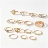 Conjunto de anéis geométricos, em forma de coração, vazados, cravejados de diamantes, best-seller europeu e americano transfronteiriço, uma coleção luxuosa e de alta qualidade de 15 peças para mulheres