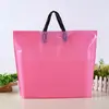 Bolsas de embalaje para ropa al por mayor, bolsas de mano de plástico de color liso, bolsas de compras para regalos de Año Nuevo, logo personalizado