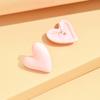 Nuevos aretes de alta gama de moda color caramelo corazón de durazno para mujer nicho único temperamento color aretes de gran amor