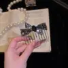 Nuevo peine invertido en forma de lazo, un accesorio para el cabello elegante y moderno para mujeres, perfecto para arreglar los cabellos sueltos y añadir un toque de elegancia y sofisticación