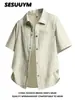Camisa masculina estilosa e versátil, estilo fino de verão, gola de lapela, padrão bolha, camisa casual solta de manga curta da moda para homens