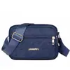 Nova bolsa feminina de ombro único para a primavera, bolsa transversal para celular e moedas para o dia a dia, estilo horizontal em tecido de nylon com quatro zíperes, bolsa de ombro feminina