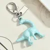 Varios Llaveros con Forma de Dinosaurio de Dibujos Animados, Flores y Corazones, Colgantes Únicos Lindos y Coloridos, Dijes Sencillos para Bolsos