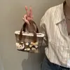 Bolso Cubo Nuevo de Cuadros Otoño/Invierno 2026 para Mujer, Bolso de Mano Lindo de Dibujos Animados, Bolso Cruzado de Lana a Cuadros para Viaje de Niños