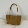 Nueva colección de primavera 2026: Bolso de mano para mujer estilo coreano, con un elegante diseño color block, gran capacidad y correa para el hombro, lo que lo convierte en un bolso tote versátil para ventas transfronterizas.