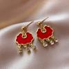 Pendientes Fuzi de perla de imitación con incrustaciones de diamantes rojos de Año Nuevo, elegantes pendientes chinos nuevos para mujer, pendientes de alta gama Sense Niche que combinan con todo.